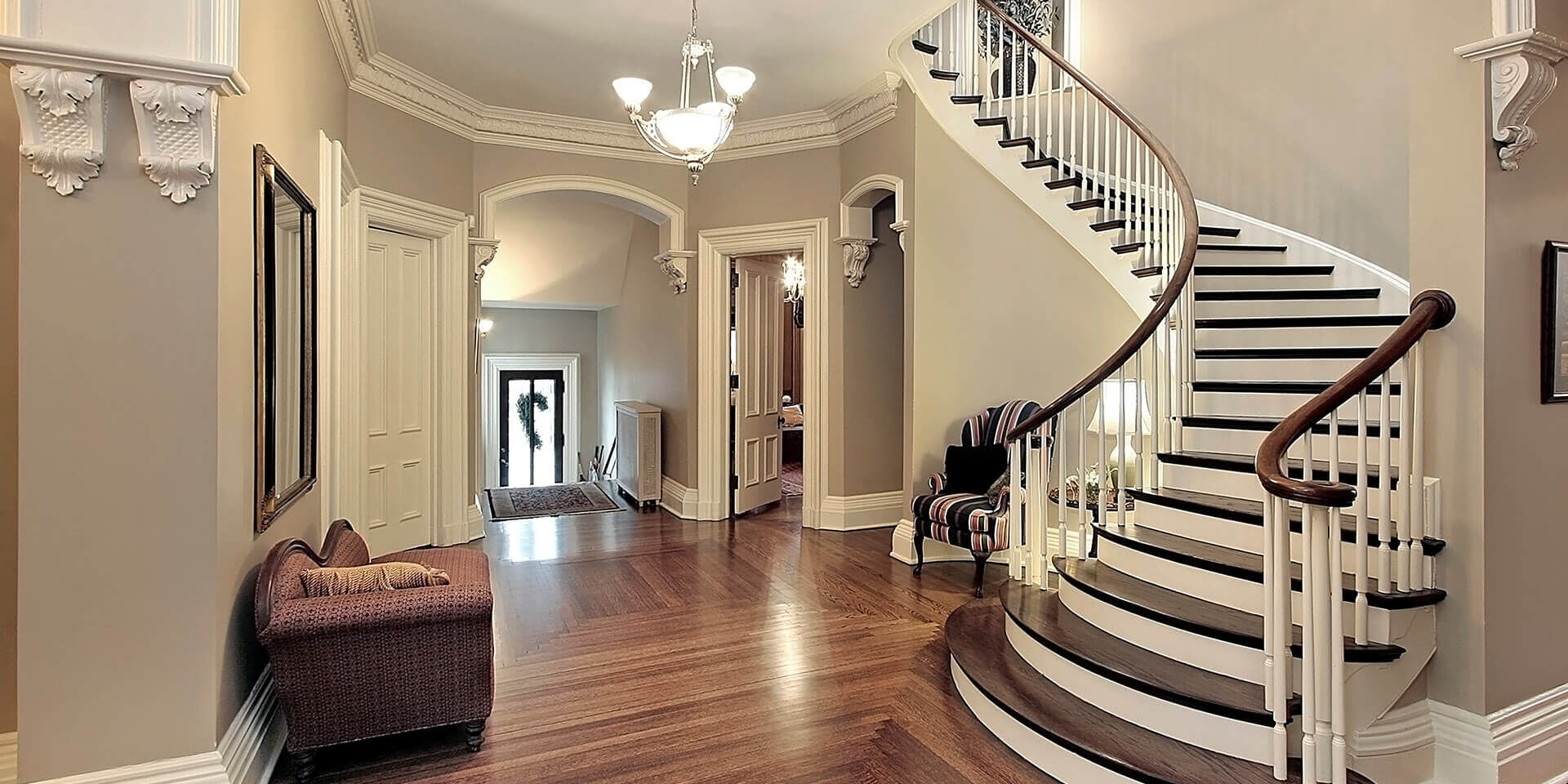 Foyer with curved staircase
